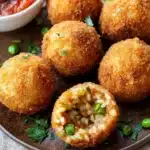 Arancini: Gefüllte Reisbällchen aus Sizilien, die süchtig machen First Image First Image